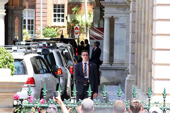 The secret service taking their job seriously as Obama enters his motorcade