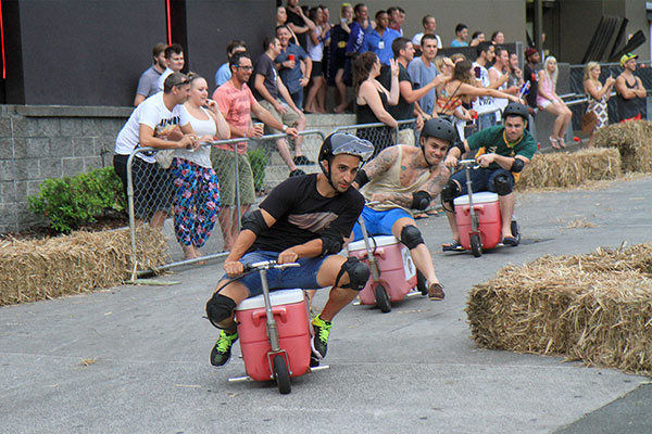 Leaning into corners like pros, the men manage to avoid the hay where all the women crashed