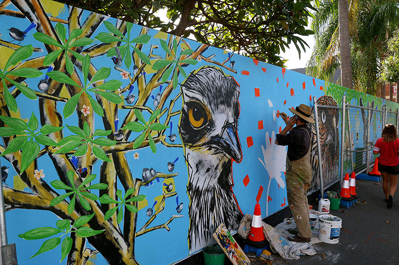 Painting the wall outside the Absoe Site