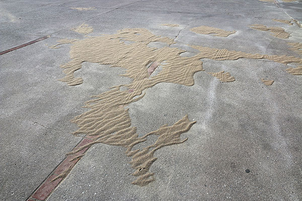 Sand blown onto the road