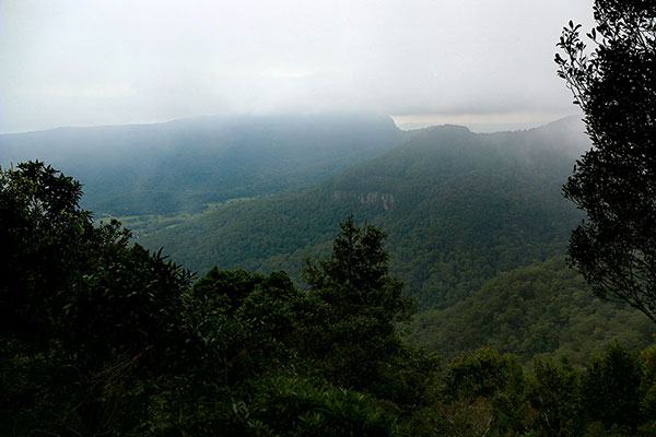 The view through the cloud and mist out over the mountains