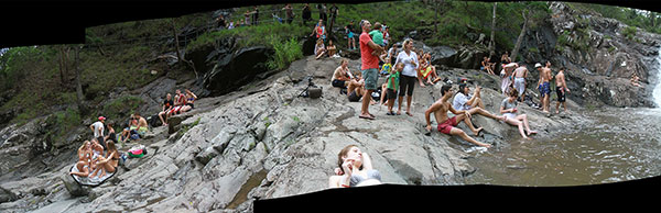 A small crowd gathered to watch people jumping into the water