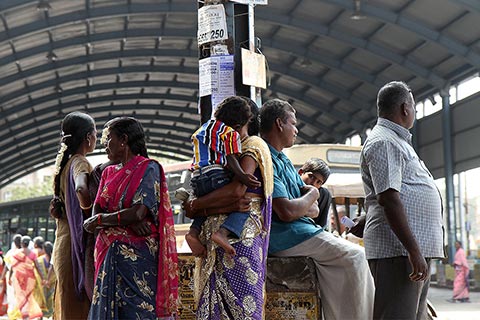 People waiting for buses