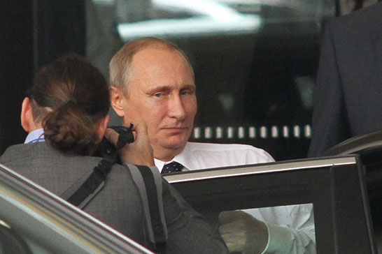 Putin gets into his limousine