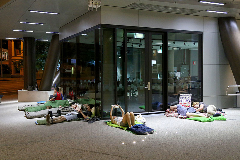 Protestors sleep at the Vigil for Baby Asha