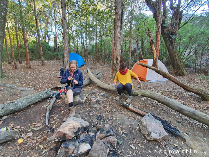 Bronwen & Carissa eating breakfast on Mt Maroon