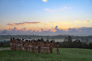 Festivalgoers watch the first dawn of the New Year