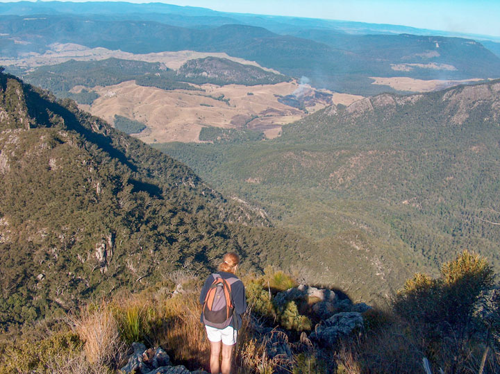 Bronwen peering into the depths from atop Mt Barney