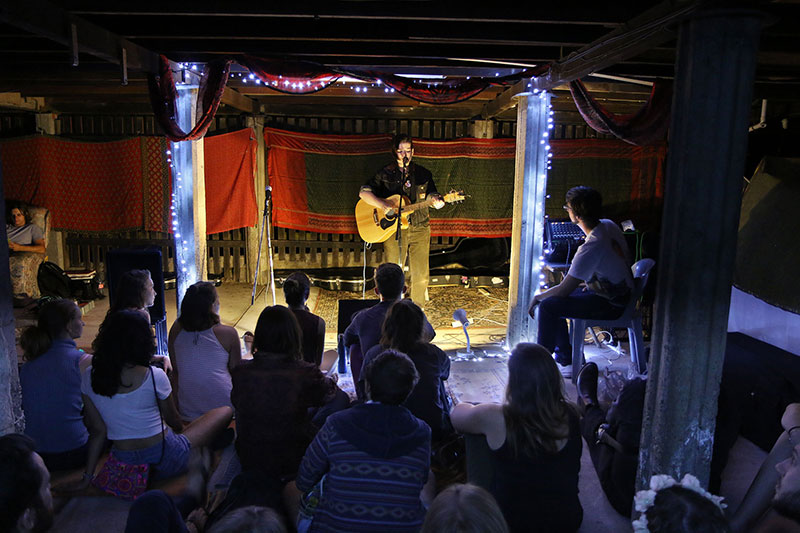 A guitarist sings at Roving Conspiracy