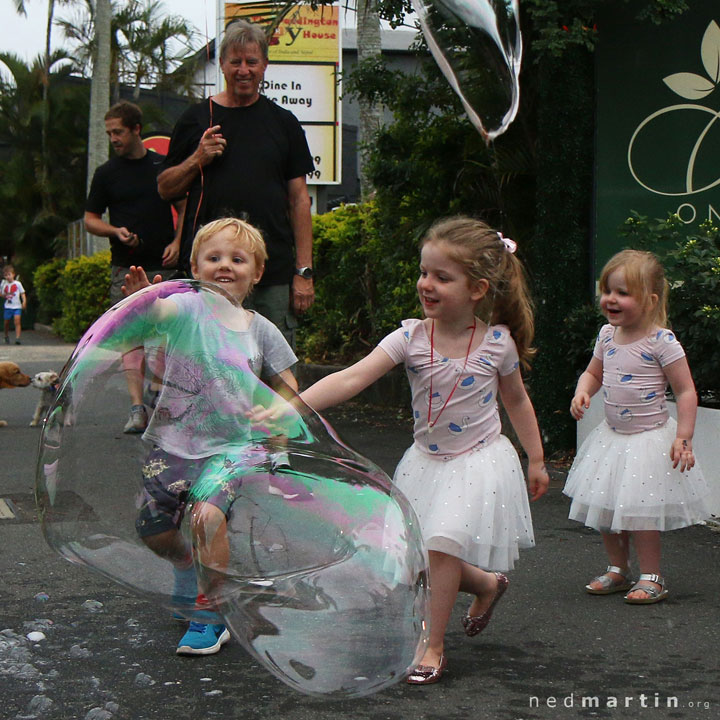 Young children delighted by Miss Bubbles’ huge bubble at the Paddington Christmas Fair