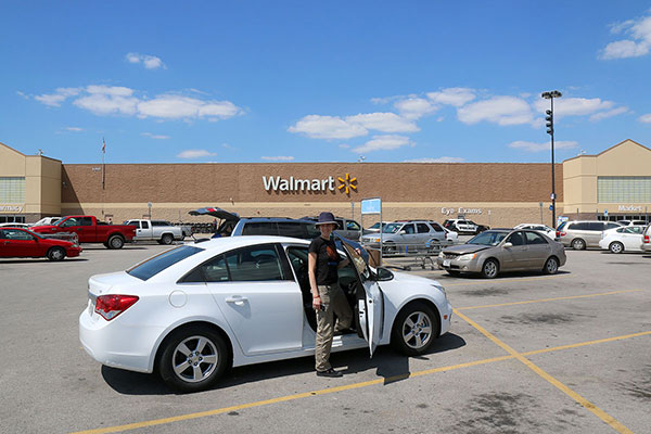Bronwen and our Chevy Cruze outside Walmart