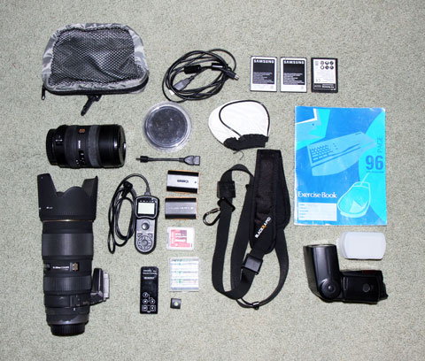 The contents of the camera bag, minus the two emergency ponchos
