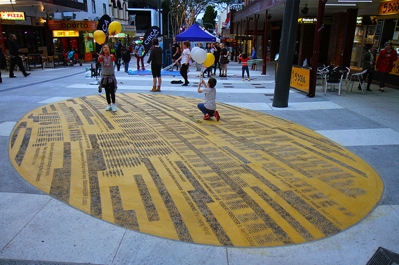 They have put strange yellow things in Brunswick Street Mall, with song lyrics on them
