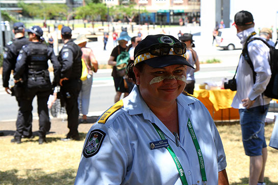 An aboriginal policewoman gets into the protest spirit