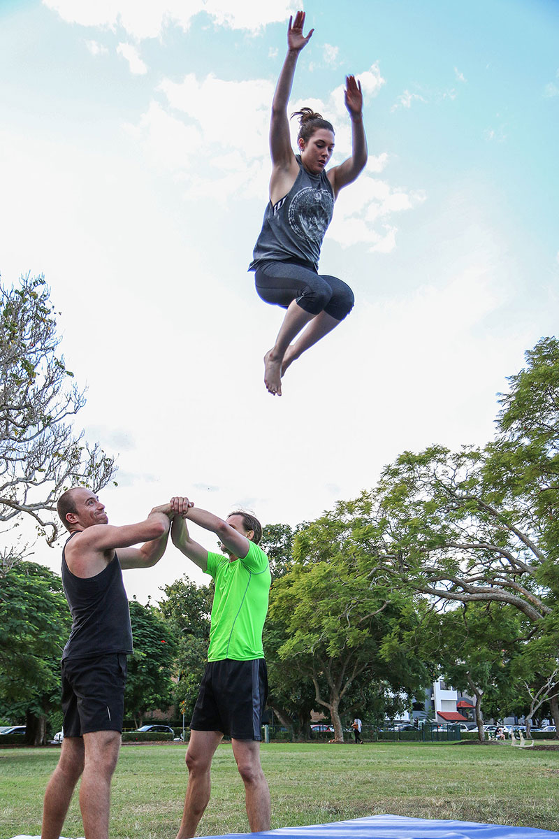 A woman flees from two men