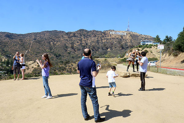 People taking photographs at the Hollywood sign