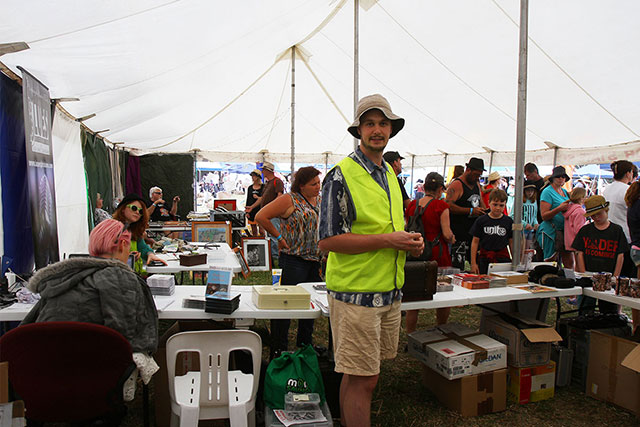 Ned in the merch tent