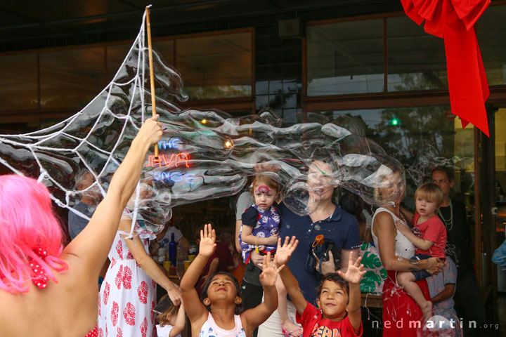 Excited children with Miss Bubbles at the Paddington Christmas Fair