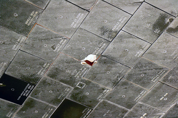 Chips in the heat shield of Endeavour