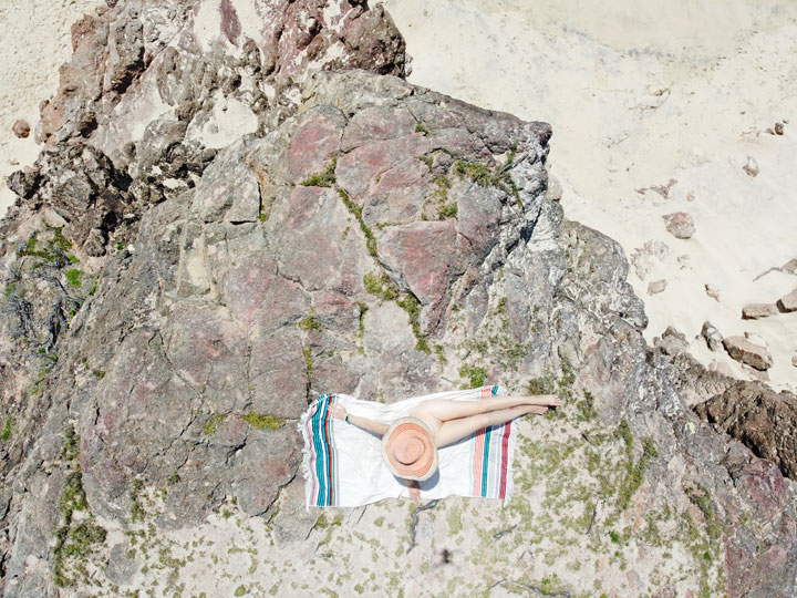 Bronwen sunbathing on a rock