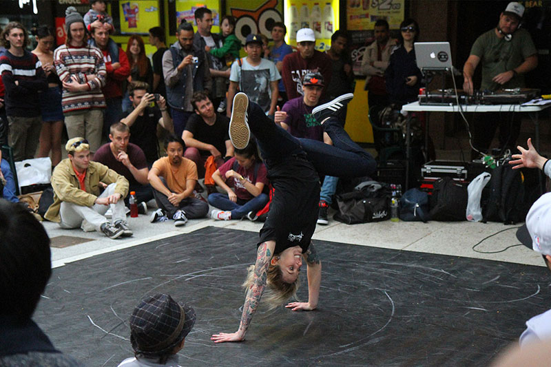A female breakdancer doing her thing