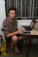 Ned at home with his laptop