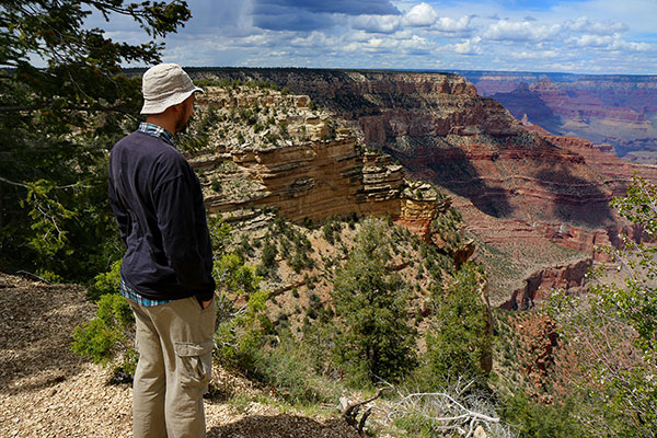 Ned looks down into the canyon