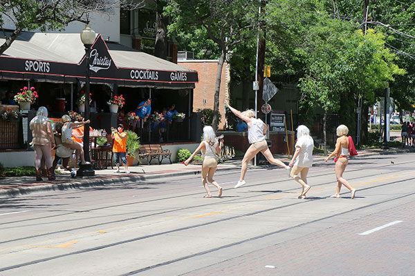 Partygoers frolic in what seems to be the drinking district of Dallas