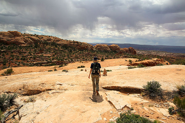 Bronwen walking towards an oncoming storm