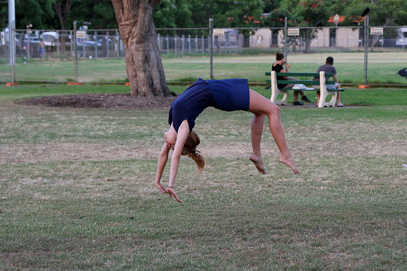 A girl casually floating around the park