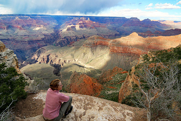 Bronwen watches clouds travel into the Grand Canyon