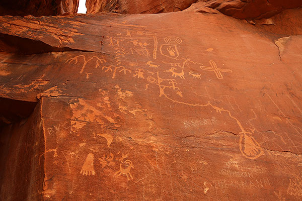 Modern graffiti and ancient petroglyphs on Atlatl Rock in the Valley of Fire