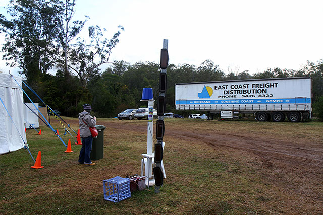 The telephone repeater. People gathered around it as if they were worshipping it