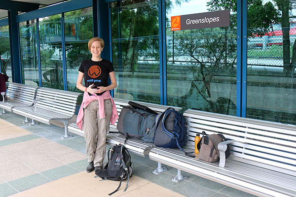 Bronwen, waiting for the bus, with all the luggage we took to America
