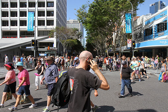 People rushing across the street in one of the short times it was open. The closed streets made it very difficult to get around the city, even on foot, at times