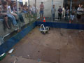 The winning robot smashing things. Note people recoiling as things fly towards them…