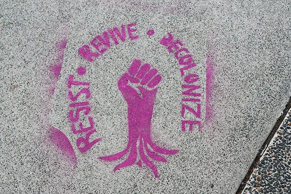 “Resist • Revive • Decolonize” seen in West End