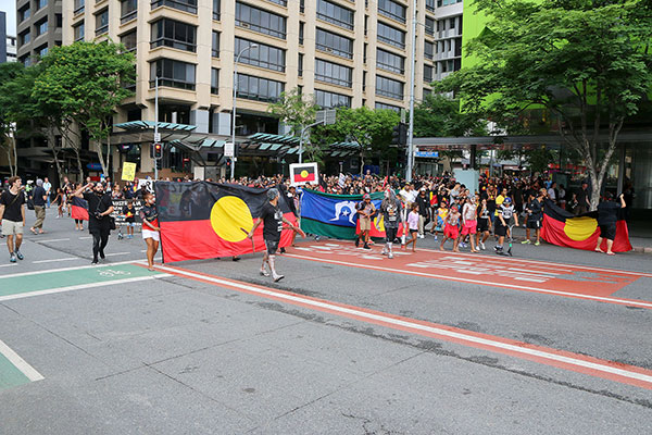 The march appears around a corner