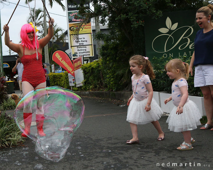 Miss Bubbles delighting young children with huge bubbles at the Paddington Christmas Fair