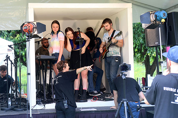 An entire band sets up in a small box