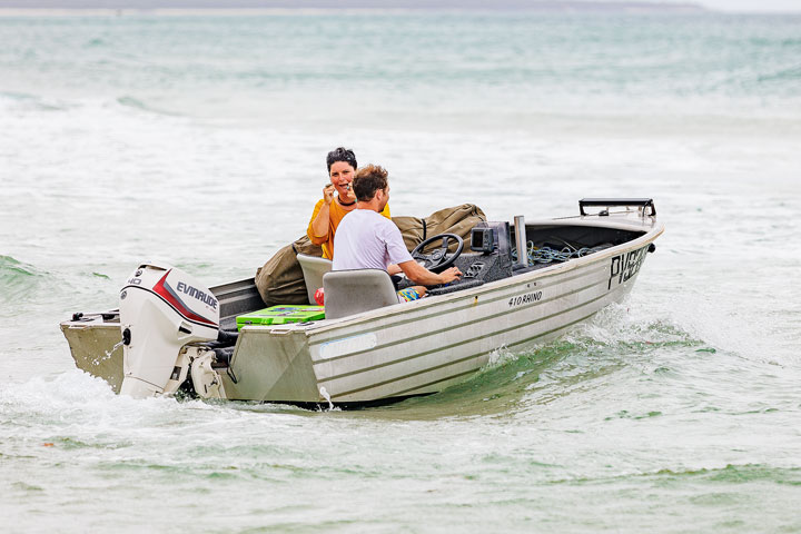 Carissa and Ben leaving in a boat, Stradbroke Island