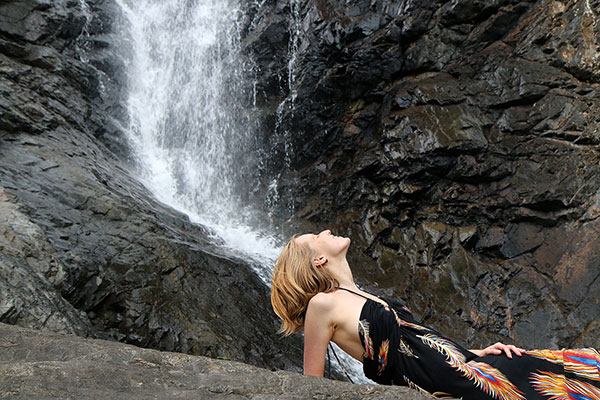 Bronwen looking up to find out where the waterfall comes from