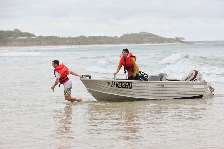 Carissa and Ben leaving in a boat, Stradbroke Island