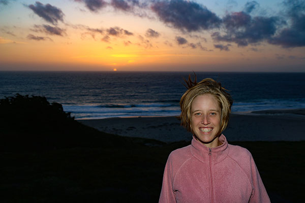 Bronwen and the sunset over the ocean along Big Sur