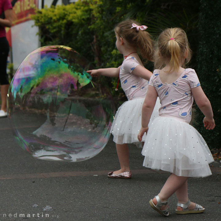 Young girls delighted by Miss Bubbles’ huge bubble at the Paddington Christmas Fair