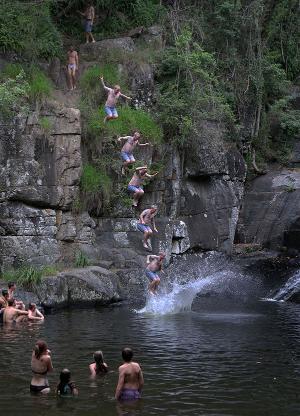 Jumping from rocks at Cedar Creek Falls