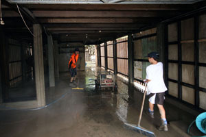 Volunteers cleaning the garage