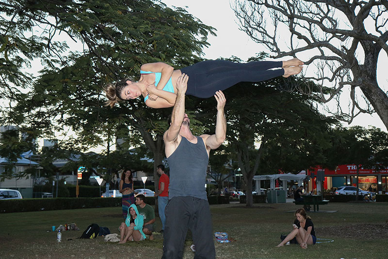 A man tossing a woman