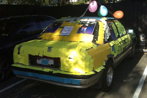 A car almost entirely covered in sticky notes