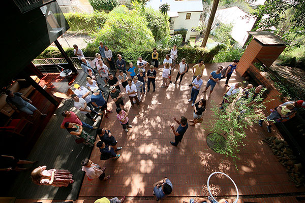 The crowd being told about the purchase and build of Dornoch Terrace House